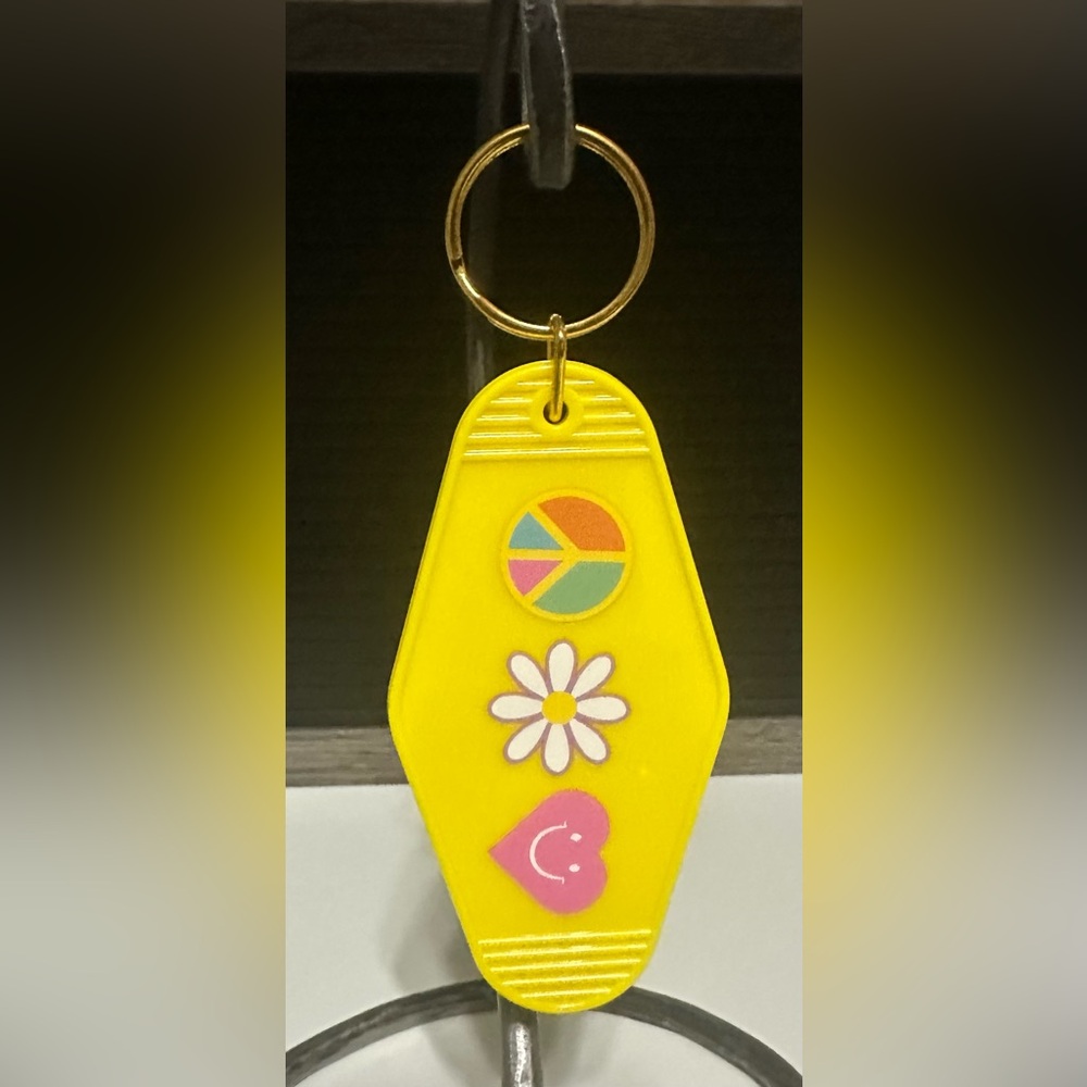 Yellow Keychain with Peace and Flower Design